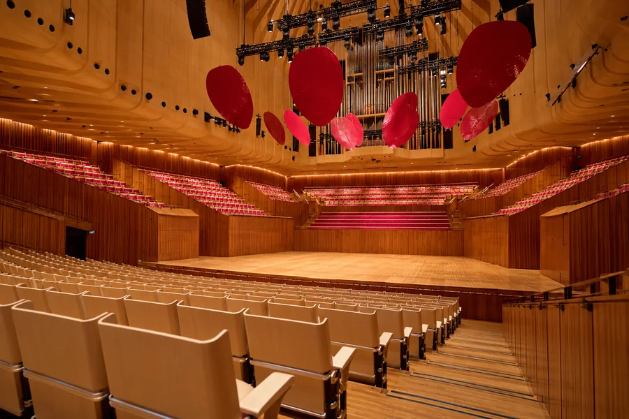 Empty Sydney Opera House Concert Hall with timber walls and red acoustic reflectors